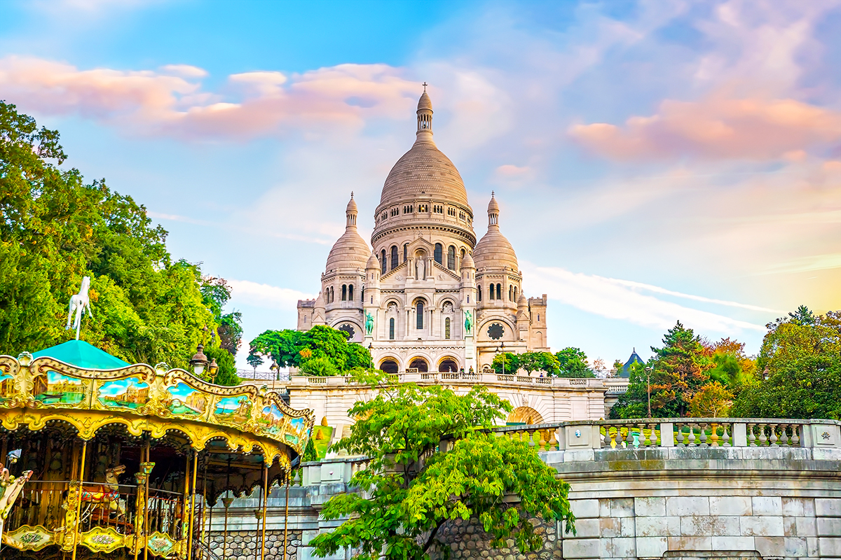 Photo of the Sacré-Coeur basilica on the hill of Montmartre, a popular tourist destination in Paris.